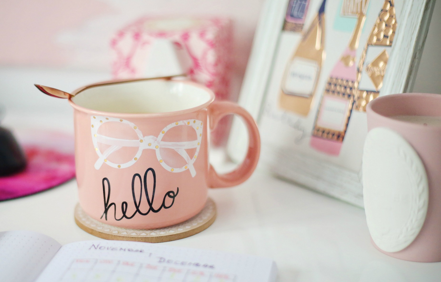 pink mug with hello desk